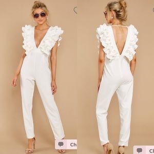 White plunge neckline ruffle jumpsuit